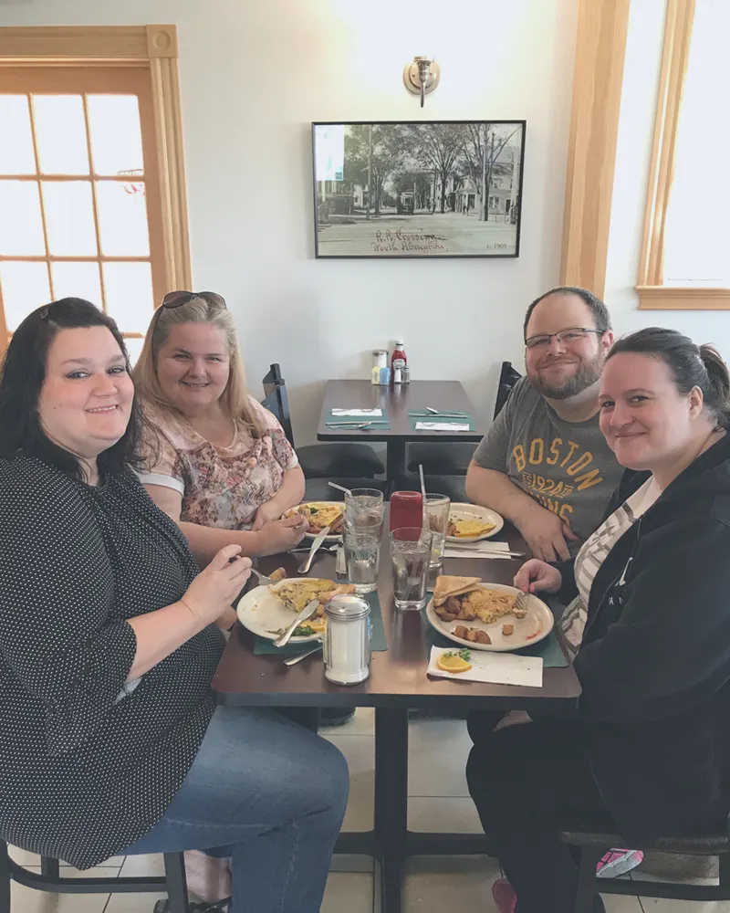 Family sharing breakfast at a table