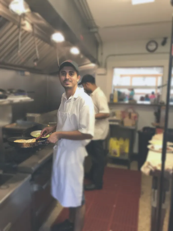 Cook working the grill