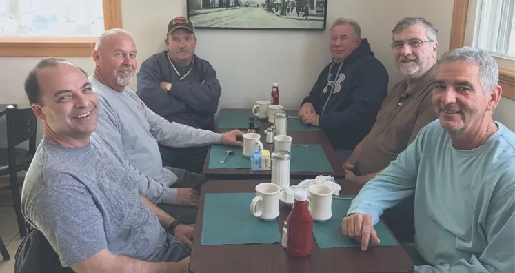 Group of regulars sharing coffee