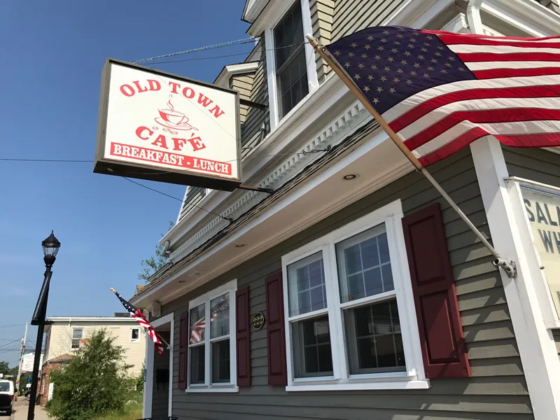 Old Town Cafe storefront on North Avenue with American flag